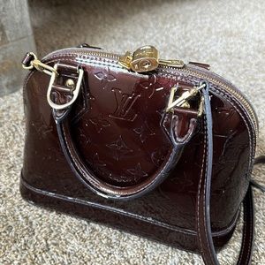 Real Louis Vuitton Alma bag.